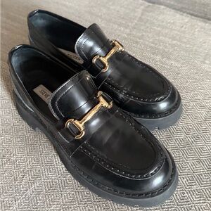 Steve Madden Glossy Black Loafers with Gold Detail